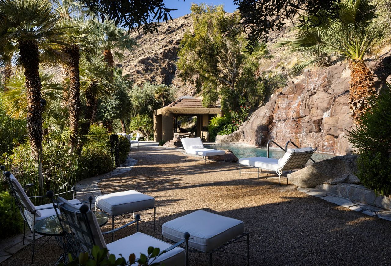 Main residence pool terrace set against the natural rock hillside