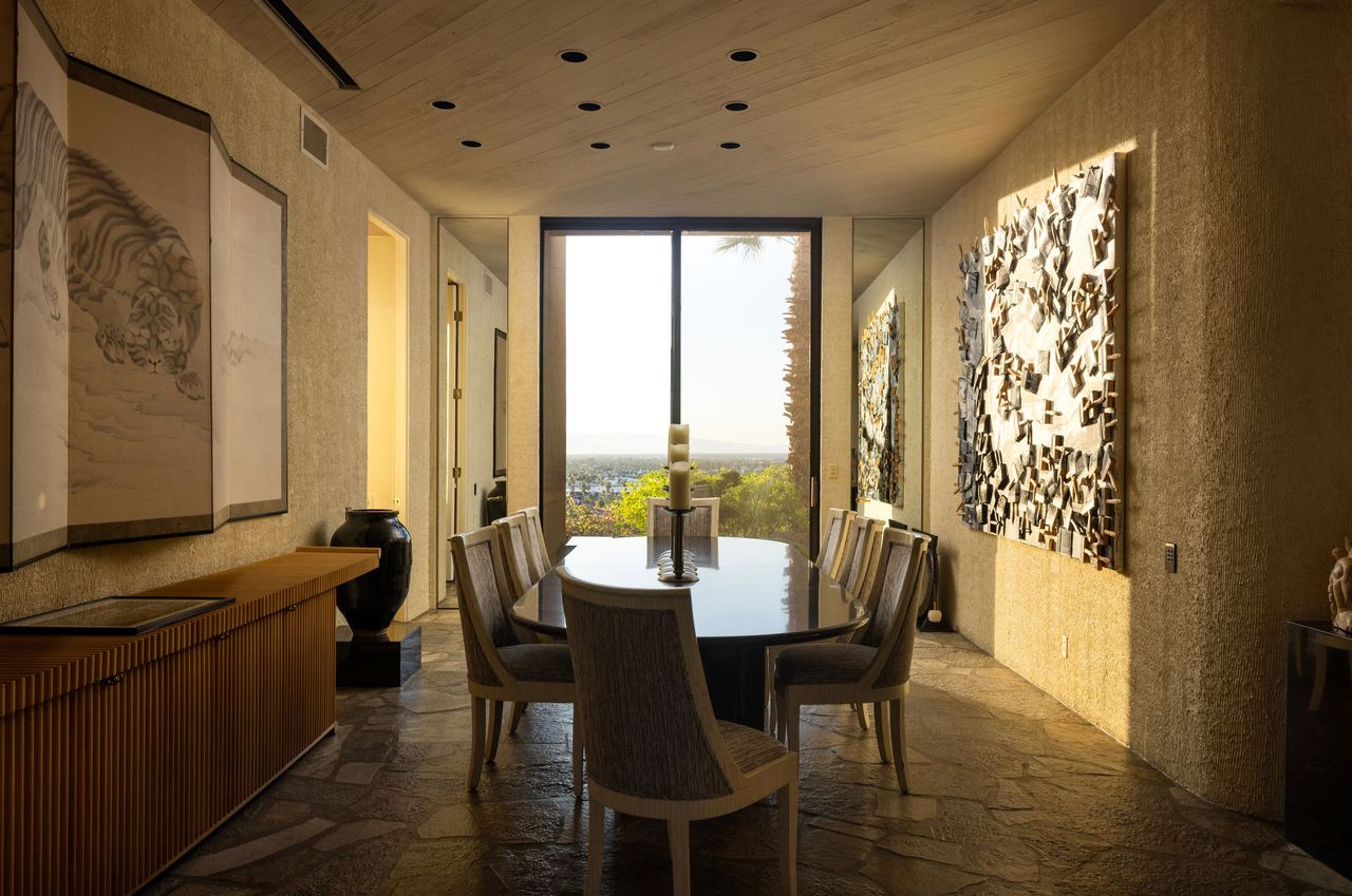 Main residence dining room with valley views through full-height glass