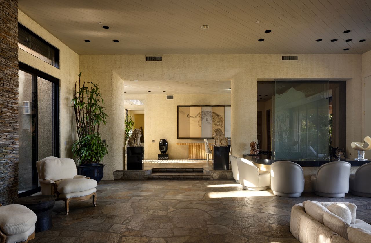 Main residence salon with seating area and layered interior volumes
