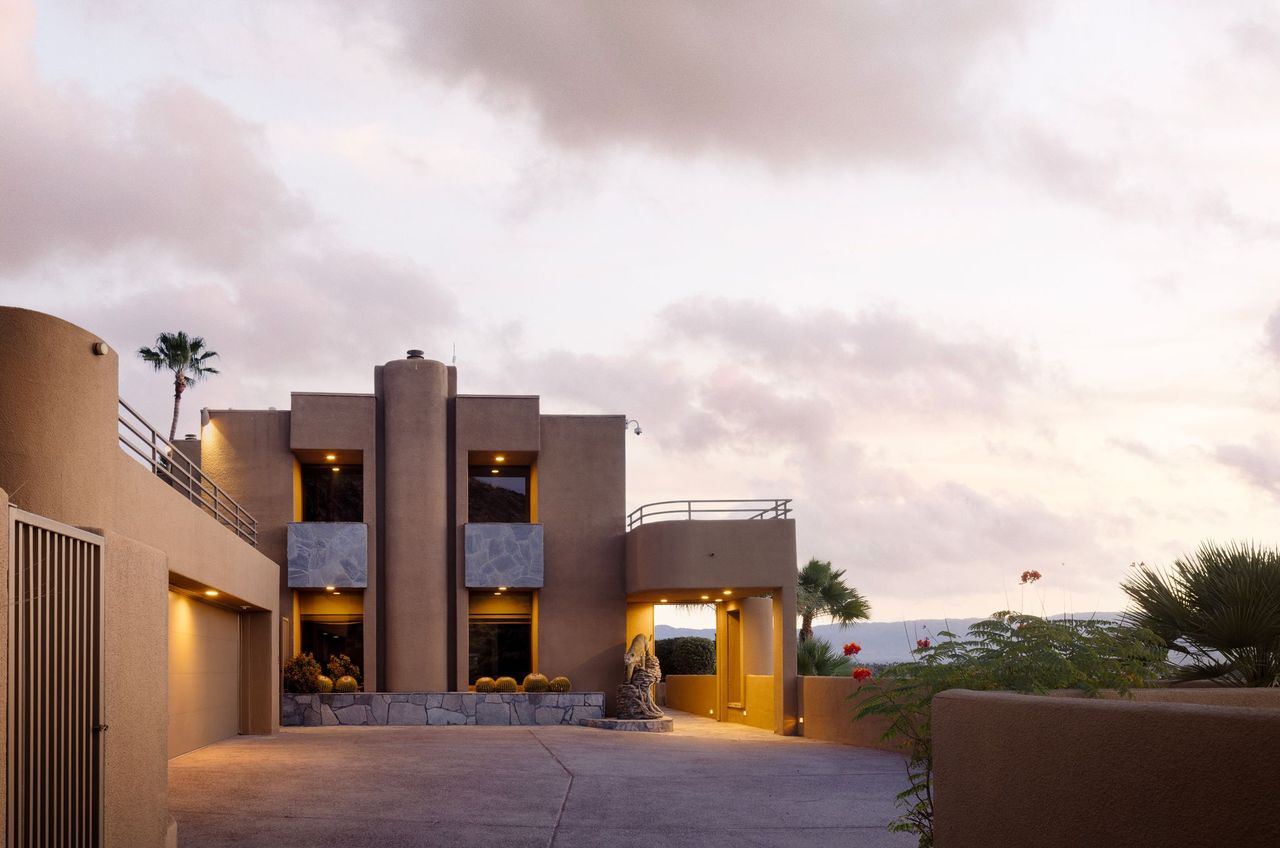 Second residence exterior at dusk with sculptural facade