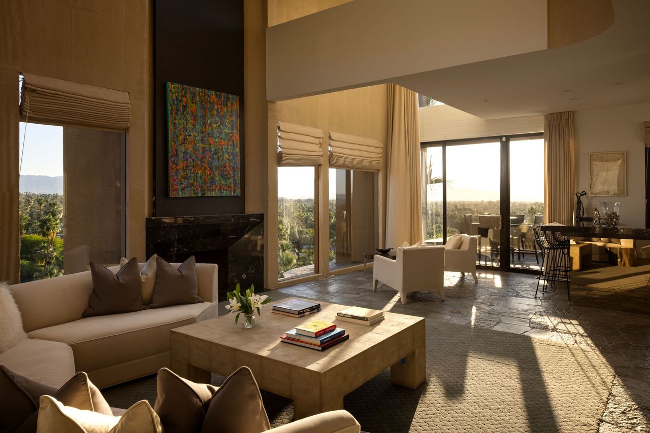 Living room with marble fireplace and valley views